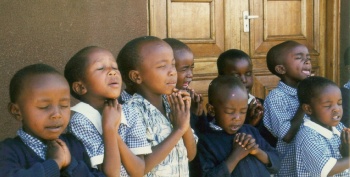 Children at prayer in Africa